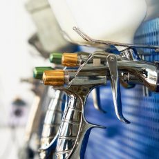 airbrush for car painting, spray gun or pistol in auto repair shop