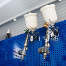 airbrush for car painting, spray gun or pistol in auto repair shop